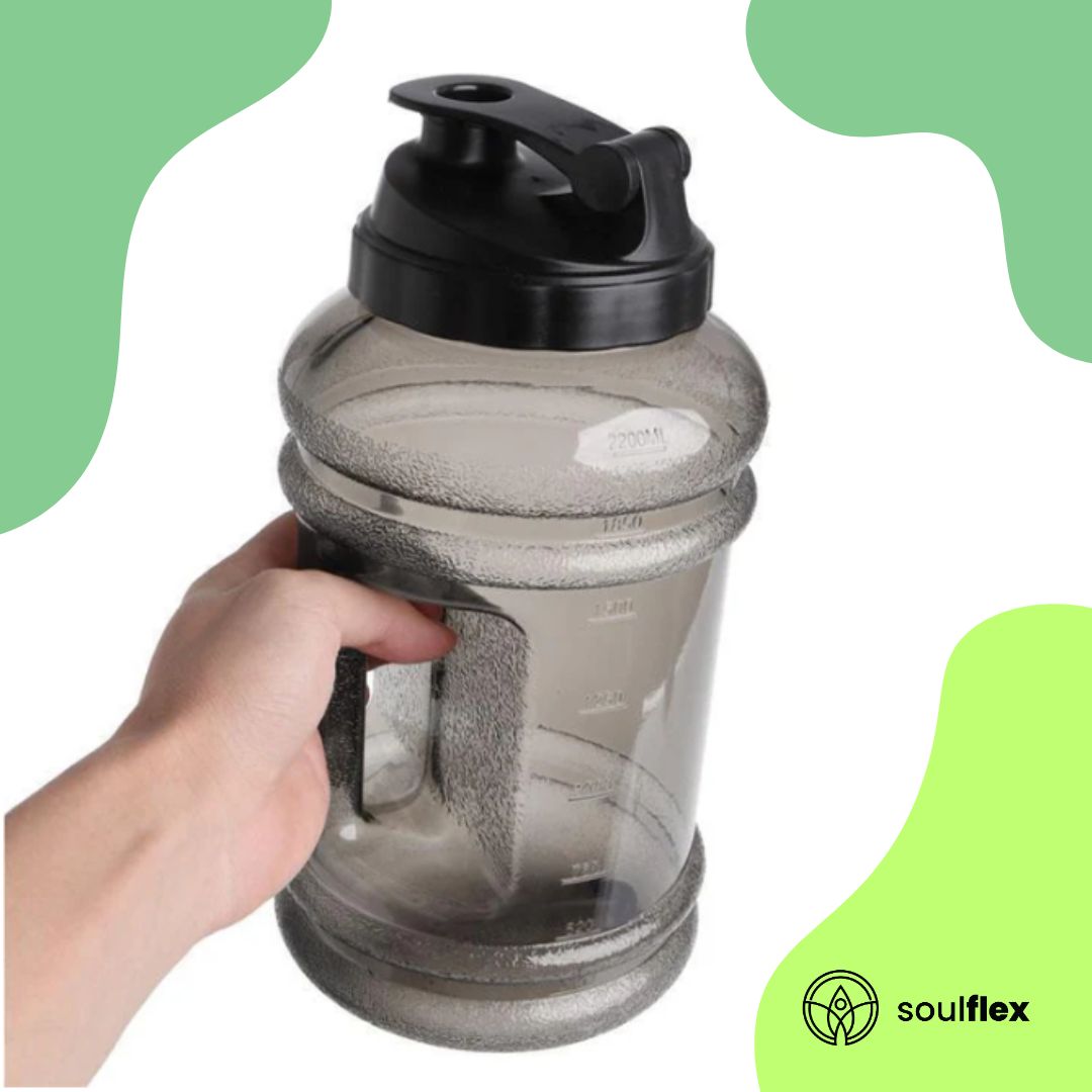 A large 2.5-liter water bottle made of durable, clear plastic with a sturdy handle on the side for easy carrying. 